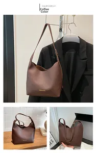 Detail view of coffee brown tote bag with FASHION & BAGS lettering in litchi grain texture