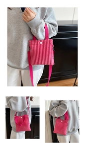 Detail of rose pink corduroy mini bag showing fabric texture and snap button closure