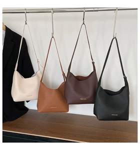 Selection of vintage soft leather tote bags in off-white, brown, coffee, and black tones