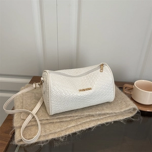 White woven cylinder crossbody bag with golden Fashion letter logo on a cozy scarf