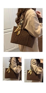 Detail of leopard print tote bag with printed silk scarf handle for daily commuting