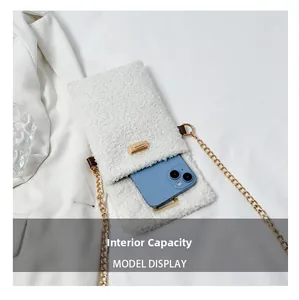 Detailed view of white faux fur crossbody bag interior showing smartphone capacity