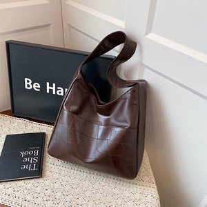 Chic dark brown hobo tote bag with geometric patchwork and vintage leather texture