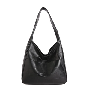 Minimalist black patchwork leather tote bag for women featuring a spacious shoulder design