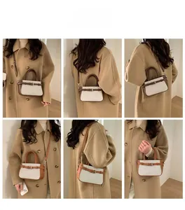 Detail of vintage canvas and leather bucket bag worn with a beige coat in various styles