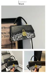 Detail of vintage leopard print handbag featuring a gold C-lock and metallic top handle