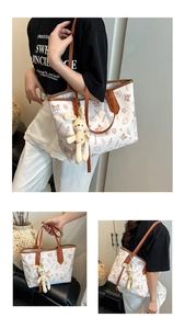 White tote bag with brown butterfly prints and a cute beige plush bunny keychain detail