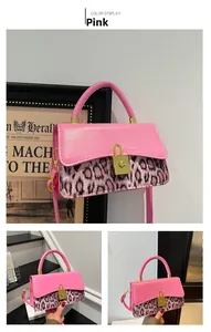 Detail of pink crossbody bag with leopard print stitching and golden buckle closure