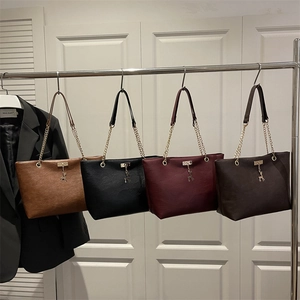 Vintage tote bag with chain handles and gold deer pendant in four chic colors