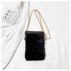 Detail of plush black mini crossbody bag featuring a golden metal chain strap and soft texture