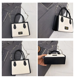 Detail views of contrast color tote bag featuring black handles and silver chain strap