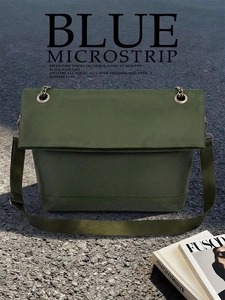 Close-up of deep green tote bag with matte texture on asphalt background
