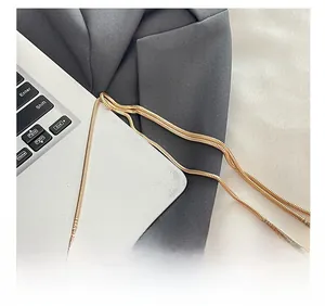 Close-up of elegant gold hardware snake chain strap for fashion shoulder handbags