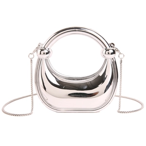 Glossy silver half-moon evening bag with circular handle and metal chain strap