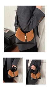 Close-up of retro bucket bag showing brown suede and black leather patchwork textures