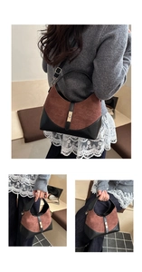 Close-up of vintage bicolor bucket bag featuring suede splicing and gold metal lock detail