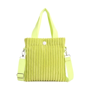 Lime green corduroy mini tote bag with round white snap button and crossbody strap