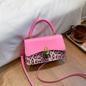 Chic pink leopard print crossbody bag with golden handle and metal turn-lock closure