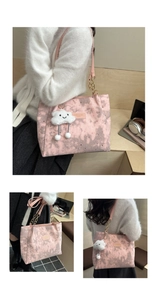 Detail view of pink canvas tote bag with star prints and cute cloud charm accessory