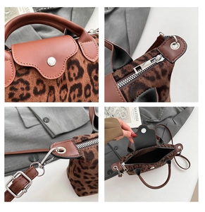 Detail of leopard print faux fur handbag featuring brown leather trim and silver metal zipper