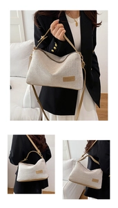 Detailed view of cream woven texture and brown leather trim on a stylish crossbody bag