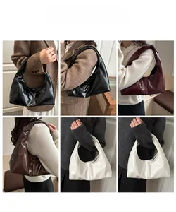 Multiple views of glossy leather underarm bags in four colors on a fashion model