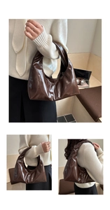 Detail of glossy chocolate brown hobo bag with soft pleated texture and sleek handle