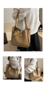 Detail of khaki bucket bag showing matte leather texture and decorative floral silk scarf