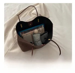 Interior view showing the large capacity of the leopard print tote with magnetic closure