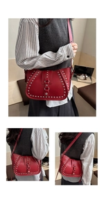 Detail view of dark red leather shoulder bag with vintage silver metal stud embellishments