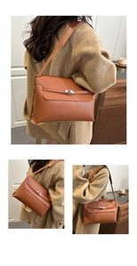 Detail of caramel leather shoulder bag showing the silver metal twist lock and texture