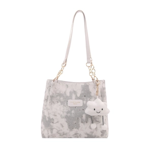 Stylish tote bag with marble pattern, silver celestial prints and cloud charm accessory