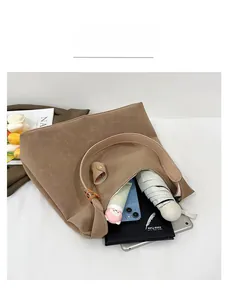 Spacious retro brown tote bag interior capacity showing tablet, umbrella, and essentials