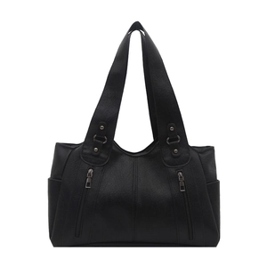Large black faux leather tote bag with silver studs and vertical zipper pockets
