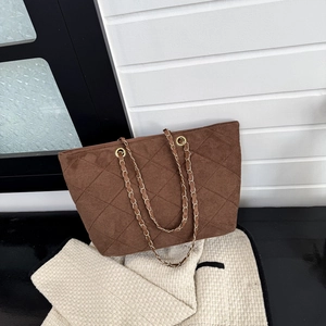 Brown quilted suede tote bag with golden metal chain straps and retro design