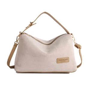 Minimalist canvas and brown leather crossbody bag with top handles and logo tag