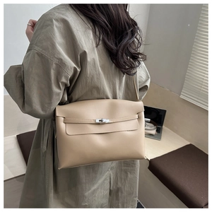 Classic beige textured leather crossbody bag with metal twist lock and strap detail