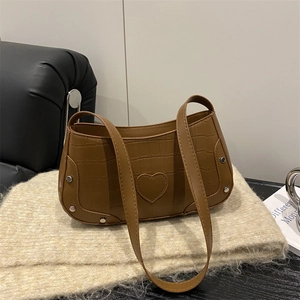 Brown crocodile texture crescent shoulder bag with heart patch and silver metal studs