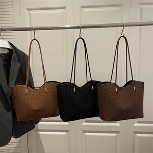 Fashionable leopard print tote bag in three colors with sleek gold hardware accents