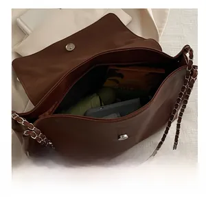 Macro view of the large capacity dark brown tote bag showing internal storage space