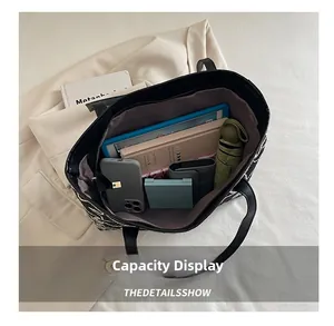 Spacious interior of woven tote bag showing capacity for tablet, phone, and daily essentials