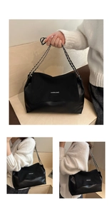 Detail view of large black chain shoulder bag featuring Fashion & Bags logo print
