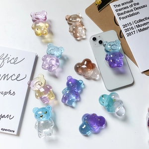 Detail of 3D bear-shaped resin phone socket with gold foil and gradient color finish