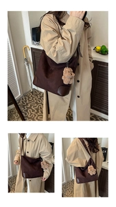 Detail of coffee suede tote bag with reinforced leather corners and plush bear charm