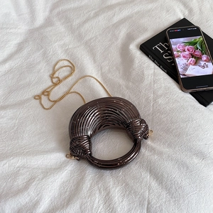 Chic acrylic bronze half-moon evening bag with metallic pleats and golden chain strap