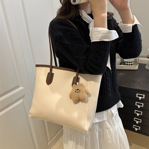 Retro large capacity cream tote bag with brown straps and cute bear charm for daily commute