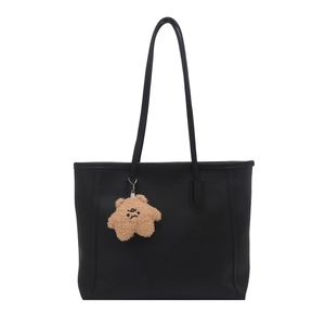 Minimalist black tote bag with long shoulder straps and brown plush charm on white background