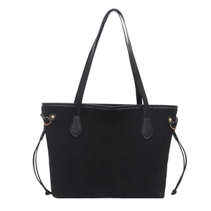Classic black suede tote bag with drawstring detail and slim shoulder straps for daily use