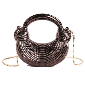 Chic dark bronze acrylic evening bag with striped texture and golden chain handle