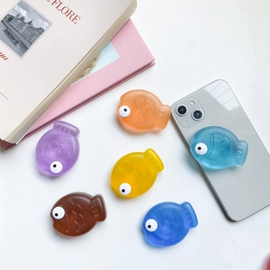 Close-up of cute 3D fish-shaped expandable phone sockets in various vibrant colors